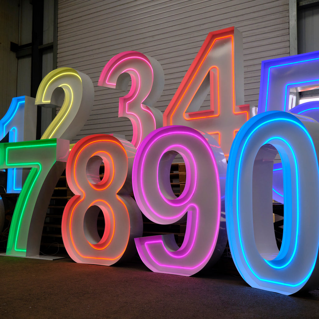 Neon numbers 0 to 9 in various colors on a dark background