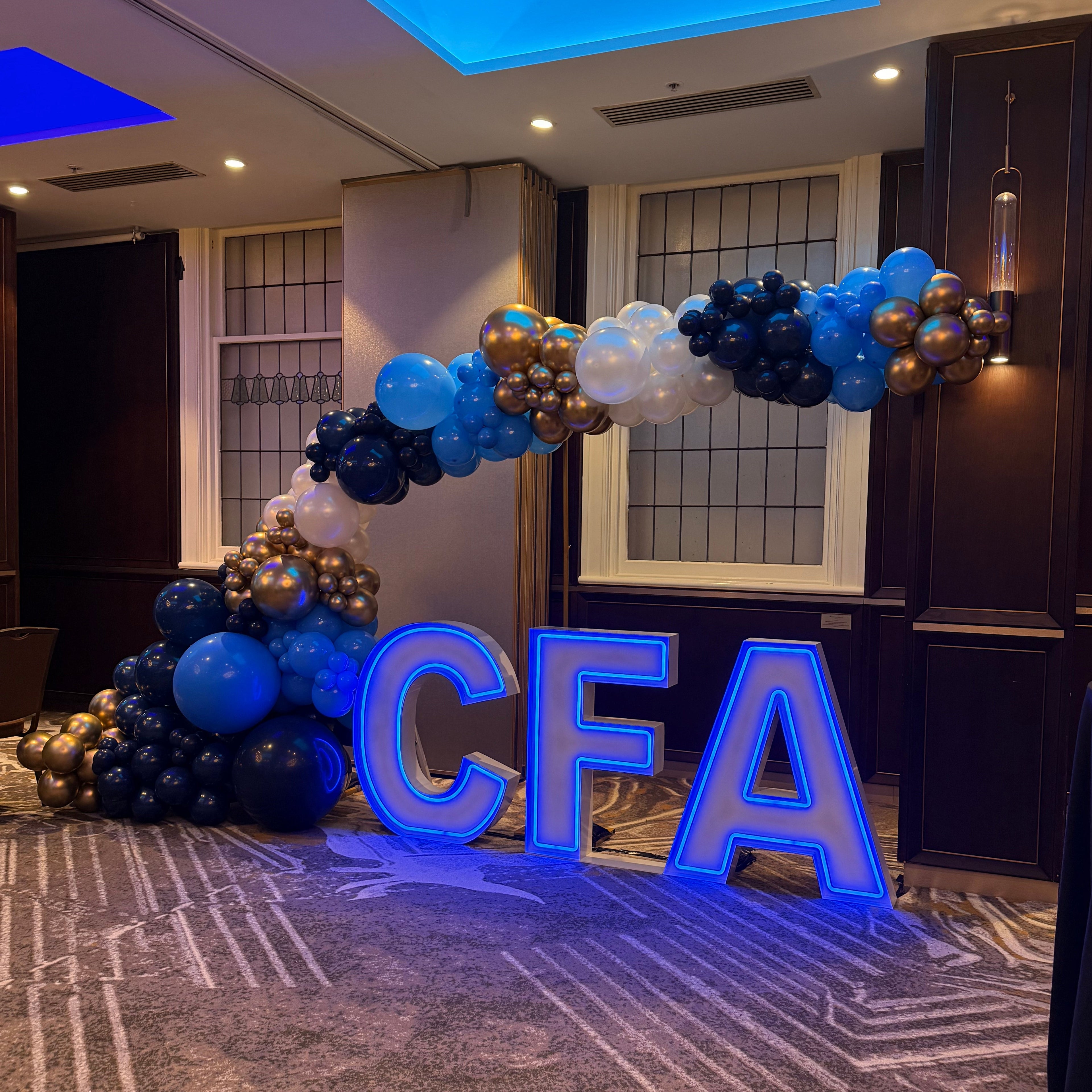 Corporate Neon Light Up Letters spelling CFA in Melbourne CBD. Blue Neon Letters for Hire. 