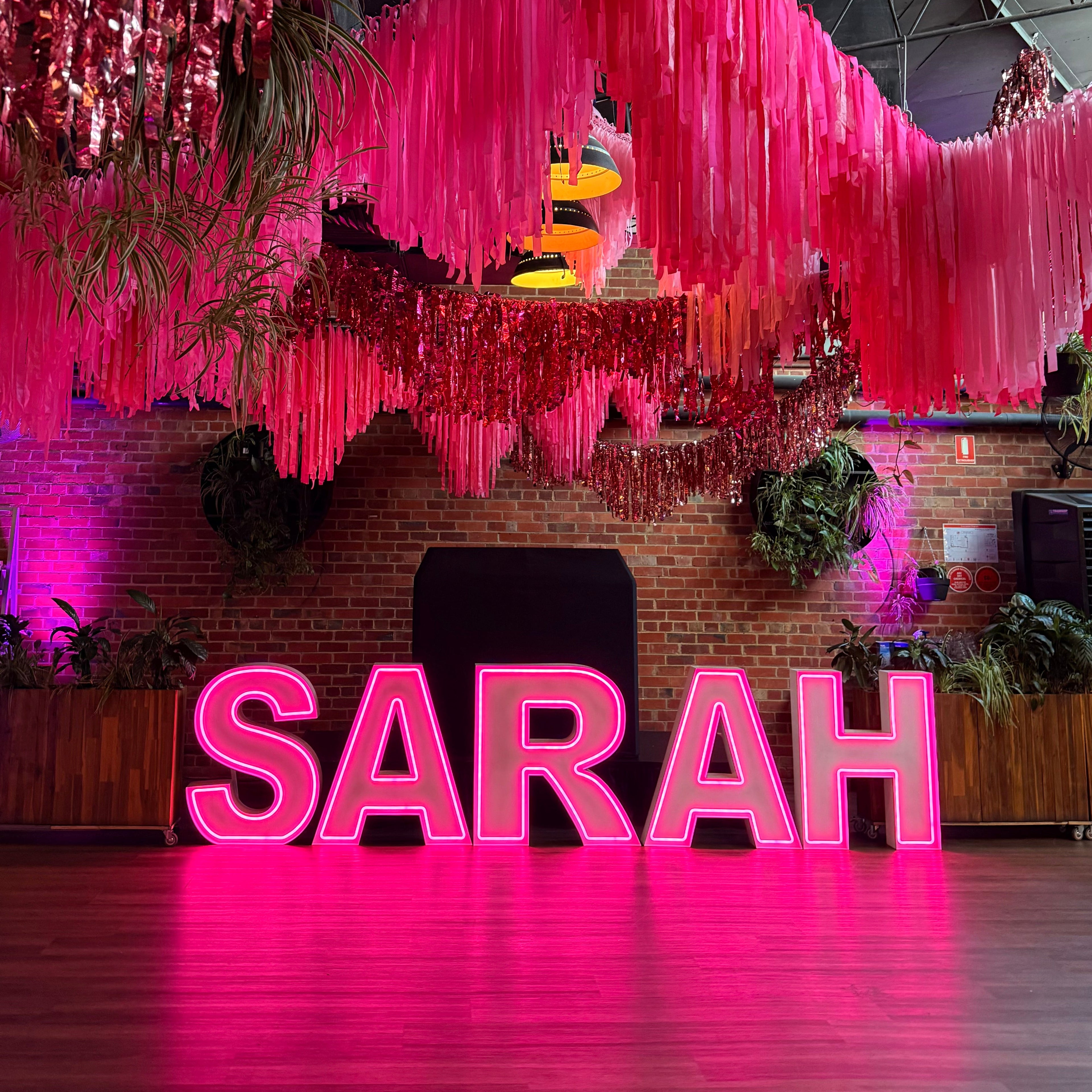 hot pink neon light up letters for a batmitzvah celebration. Giant Neon Letter Hire Melbourne
