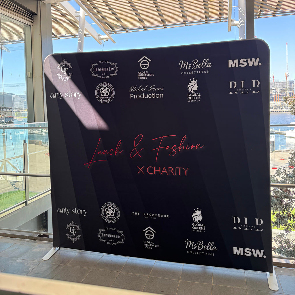 A 2.5m x 2.3m Black customised media wall with corporate logos set up for an event in Melbournes Docklands.