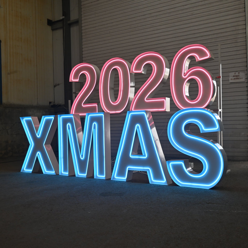 Neon sign with '2026 XMAS' in a warehouse setting
