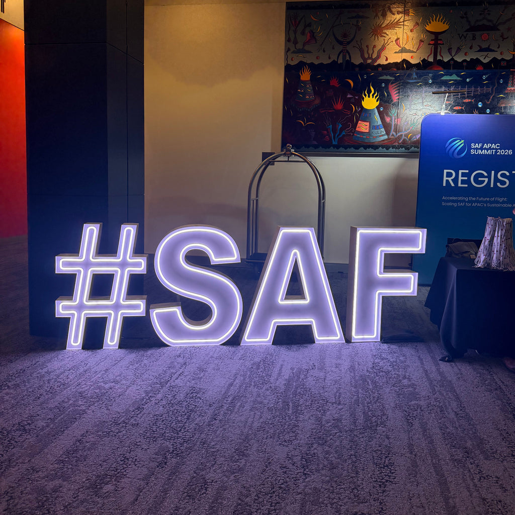 Giant Light Up Neon Letters and Neon Symbols for the registration desk at Melbourne Convention and Exhibition Centre. Corporate Neon Letters for Hire. 
